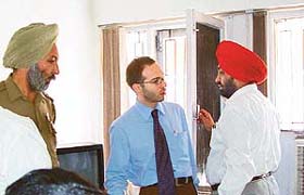 Officials of Panchayat Bhavan explain a point to the legal attache of the Swiss Embassy who visited the city