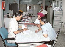 A senior official of Punjab National Bank inspects documents at the bank�s Sector 22 branch