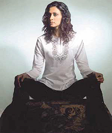 A model displays the Spring-Summer Collection 2003 from Anjjane.