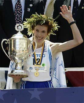 Svetlana Zakharova of Russia raises her trophy after winning the women's division of the 2003 Boston Marathon