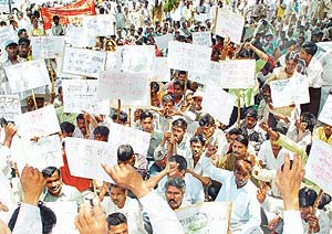 Members of the Sweepers Union of Chandigarh hold a protest rally against privatisation outside the MC office in Chandigarh on Wednesday