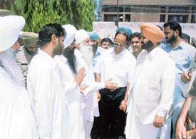 Punjab Minister for Jails and Urban Development Malkiat Singh Birmi interacts with prisoners