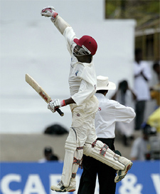 West Indies� Brian Lara celebrates after scoring his first century on his home ground 