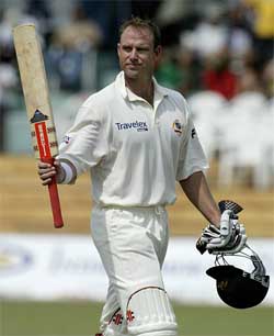 Mathew Hayden acknowledges the crowd's applause after scoring a century against the West Indies 