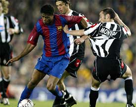 FC Barcelona's Patrick Kluivert battles for the ball against Juventus defender Paolo Montero 
