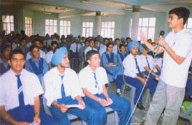 Mr Mathew, Coordinator of the Delhi Retreat Team, interacts with students during an orientation programme at Sacred Heart Senior Secondary School