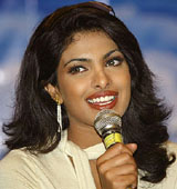 Former Miss World and Bollywood actress Priyanka Chopra speaks during a news conference