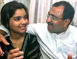 Mohammed Anis Saboowalla smiles at his daughter Khairunnisa