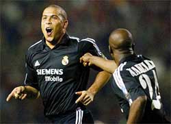 Real Madrid's Ronaldo celebrates after scoring his third goal