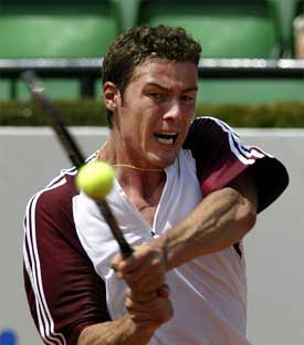 Russia's Marat Safin makes a backhand return against Finland's Jarkho Nieminen