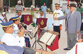 The UT Administrator, Lieut-Gen J.F.R. Jacob (retd), conducts a band of the Chandigarh police at the inaugural function of the Lake Club on Friday. 