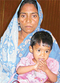 Asha and her daughter, Sangita, wait for the family�s breadwinners to be released from the Burail jail
