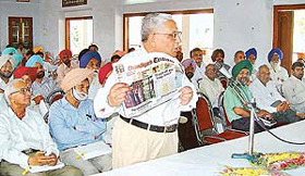 A resident of Kharar, Dr S.N. Dua, makes a point during the interactive session organised by The Tribune in Kharar on Sunday.