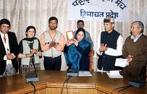 Mrs Pratibha Singh, wife of Himachal Pradesh Chief Minister Virbhadra Singh, releases a book