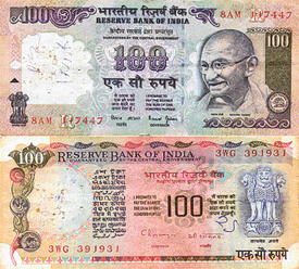 Rs 100 notes bearing a portrait of Mahatma Gandhi and the Ashoka Pillar 