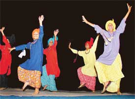 Bhangra artistes of the Malwa Sabhyacharak Bhangra Club present a programme at a craft exhibition