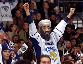 A Finland fan wears an Osama Bin Laden mask as he supports his team during the Ice Hockey World championship match between Finland and Slovakia