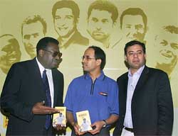 Former West Indies cricket captain Clive Lloyd talks with Harsha Bhogale and Manu Sawhney of ESPN-Star Sports 