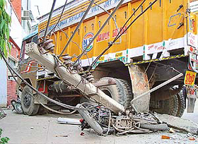 A truck rammed into an electric pole damaging two scooters, a motor cycle and three cars in Industrial Area, Chandigarh, on Wednesday. 
