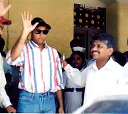 Maharashtra's first SARS patient Stanley D'silva waves his hand to the media 