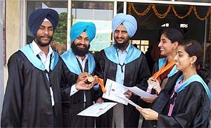 Jubilant college graduates celebrate after getting degrees
