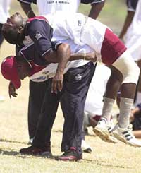 West Indies captain Brian Lara lifts Jermaine Lawson on to his back during a team practice in Barbados on Tuesday. 