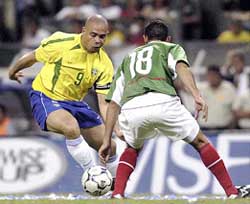 Brazil's soccer player Ronaldo controls the ball 