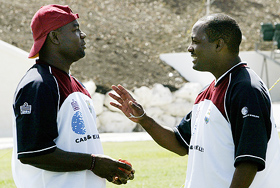 West Indies Captain Brian Lara chats with injured wicket-keeper Ridley Jacobs