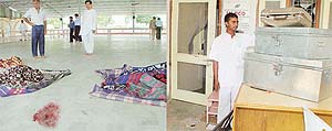 Blood-splattered floor at Sant Shri Asa Ramji Ashram, Seonk, Kharar, where robbers struck on Friday morning; and (right) broken door and boxes at the ashram