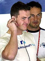 Williams Formula One driver Ralf Schumacher of Germany smiles after clocking the best time during the first free practice session
