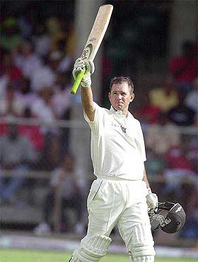 Ricky Ponting of Australia raises his bat after reaching his third Test century of the series 