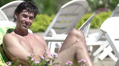 New Zealand captain Stephen Fleming relaxes by the pool in Kandy, Sri Lanka