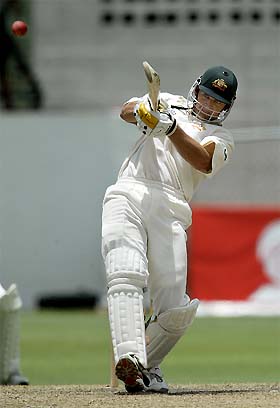 Australia's Adam Gilchrist hits a six 