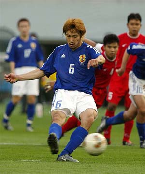 Japan's Yuki Abe kicks a penalty to score the third goal 