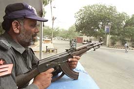A Pakistani policeman stands guard near the US consulate in Karachi