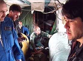 A television image shows American cosmonaut Donald Pettit