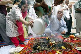 Hindu believers perform yajna