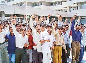 Employees of the GMCH, Sector 32, raise slogans against the termination of the services of their counterparts  in Chandigarh on Monday.