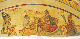 Guru Nanak Devji with his deciples on the temple wall