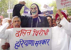Former Union Minister Buta Singh and former Industry Minister of Haryana K.R. Punia lead a demostration with Dalit victims of Harshola village in Kaithal district
