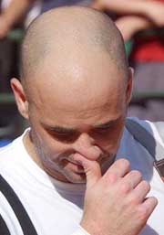 Andre Agassi of the US leaves the court 