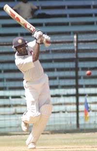 Wasim Jafer of Mumbai caresses the ball to the fence