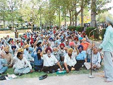 Striking PSEB employes stage a dharna in front of their office in Ludhiana 