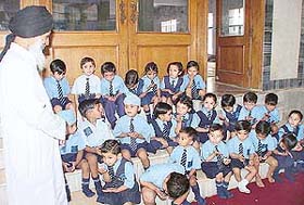 Students of Little Angels School interact with Maulana Mohammed Ajmad Khan at Jama Masjid, Sector 20, Chandigarh, on Thursday.