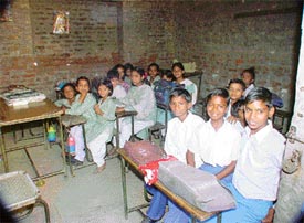 Students of the primary wing of Government Model School, Dholewal Chowk, attend class