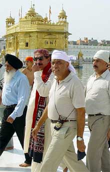 Pakistani parliamentarians walk inside the precincts of the Golden Temple 