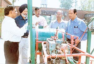 Dr I.K. Garg, Head, Department of Farm Engineering, explains the functioning of a spray machine to a delegation of Sri Lankan scientists at the PAU in Ludhiana on Friday.