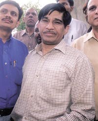 Kundan Lal, Joint Director, MCD, being produced at the Tis Hazari courts in the Capital on Friday.