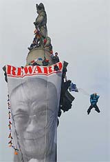 Stunt man Gary Connery performs a base jump from the Nelson's Column