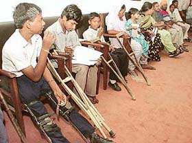 Handicapped children participate in a seminar "The persons with disability" at Kisan Bhavan